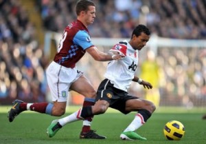 Villa's Jonathan Hogg (left) tackling Nani (right)
