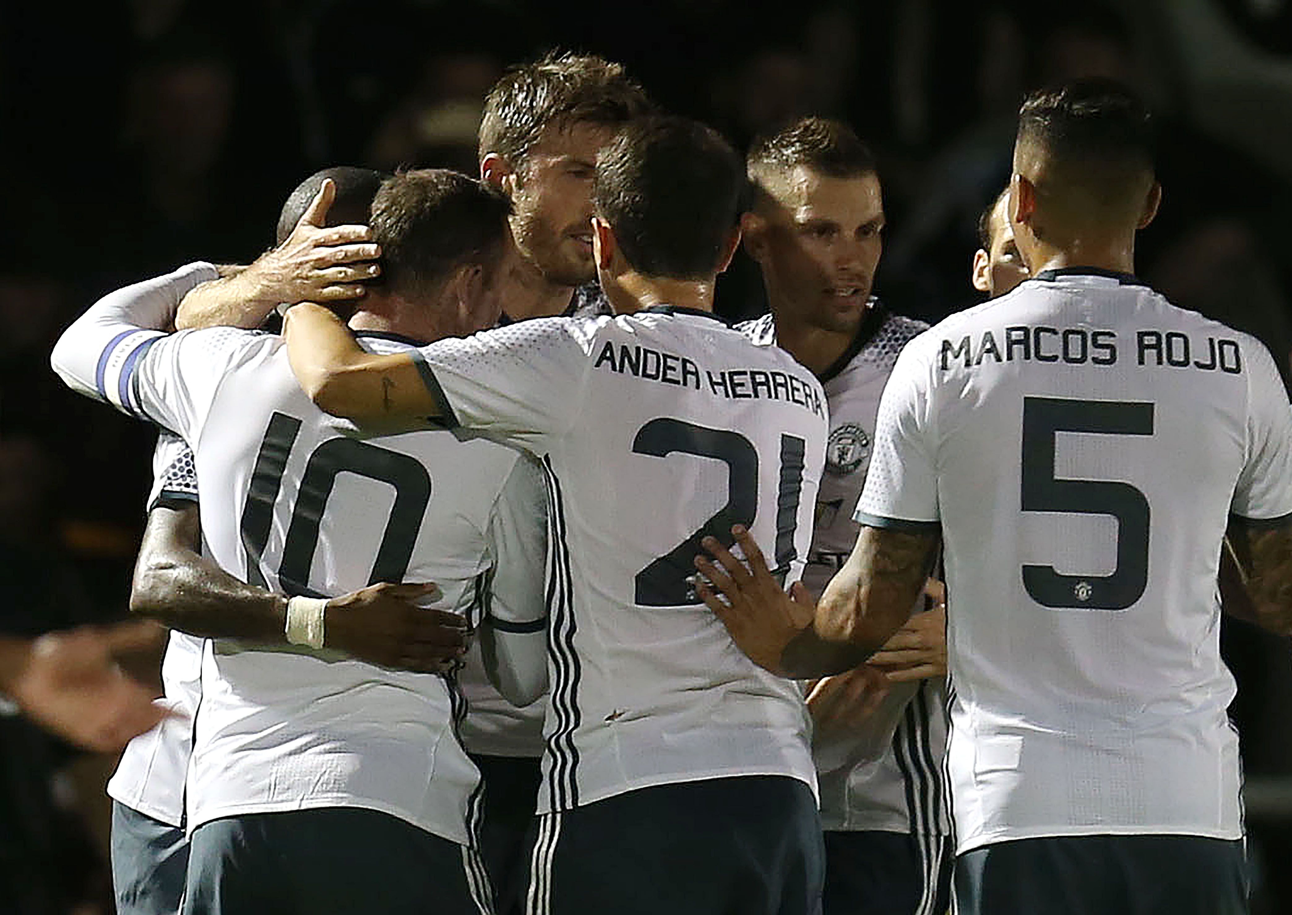 United celebrate at Northampton Town