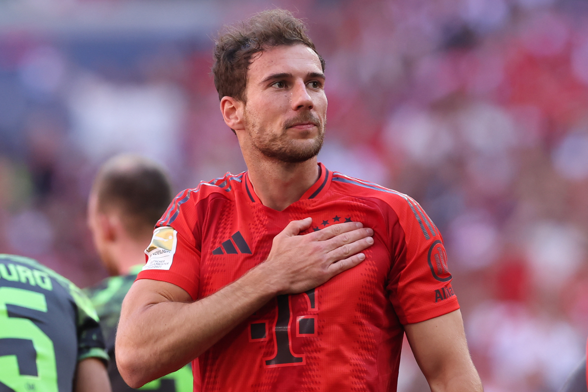 Leon Goretzka puts his hand on Bayern Munich's crest