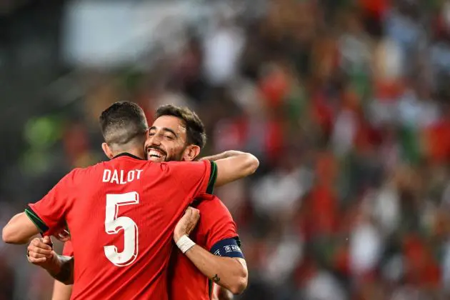 Bruno Fernandes and Diogo Dalot sharing a hug in Portugal match