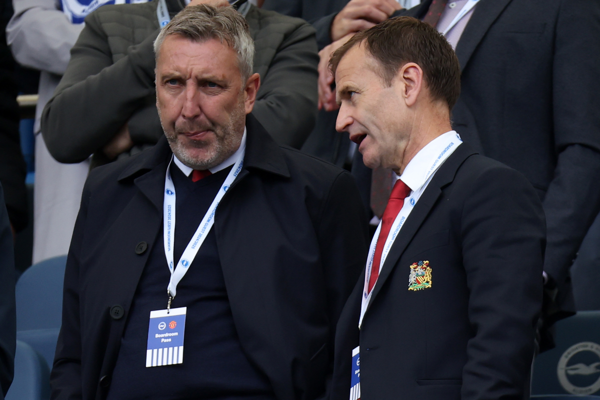 Jason Wilcox chats with Dan Ashworth while in attendance at a Man United game.