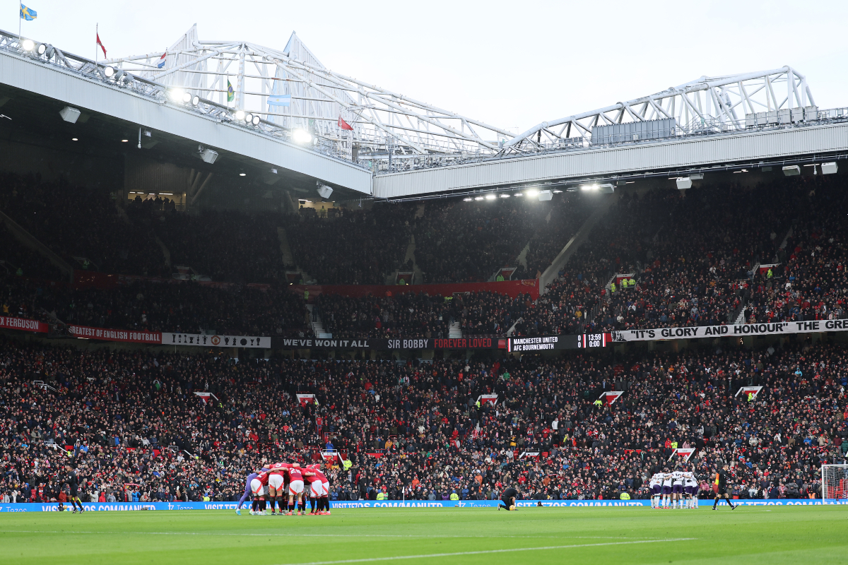 A general view of the Man United players huddling inside Old Trafford.