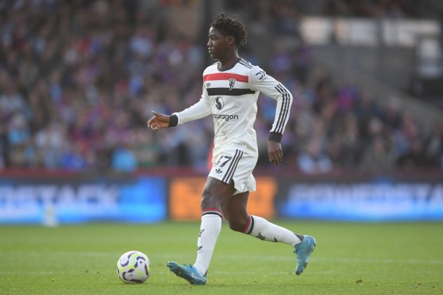 Kobbie Mainoo run with the ball while in action for Man United against Crystal Palace.