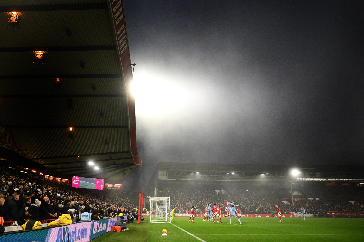 Nottingham Forest players vie with Tottenham Hotspur players in their match at the City Ground.