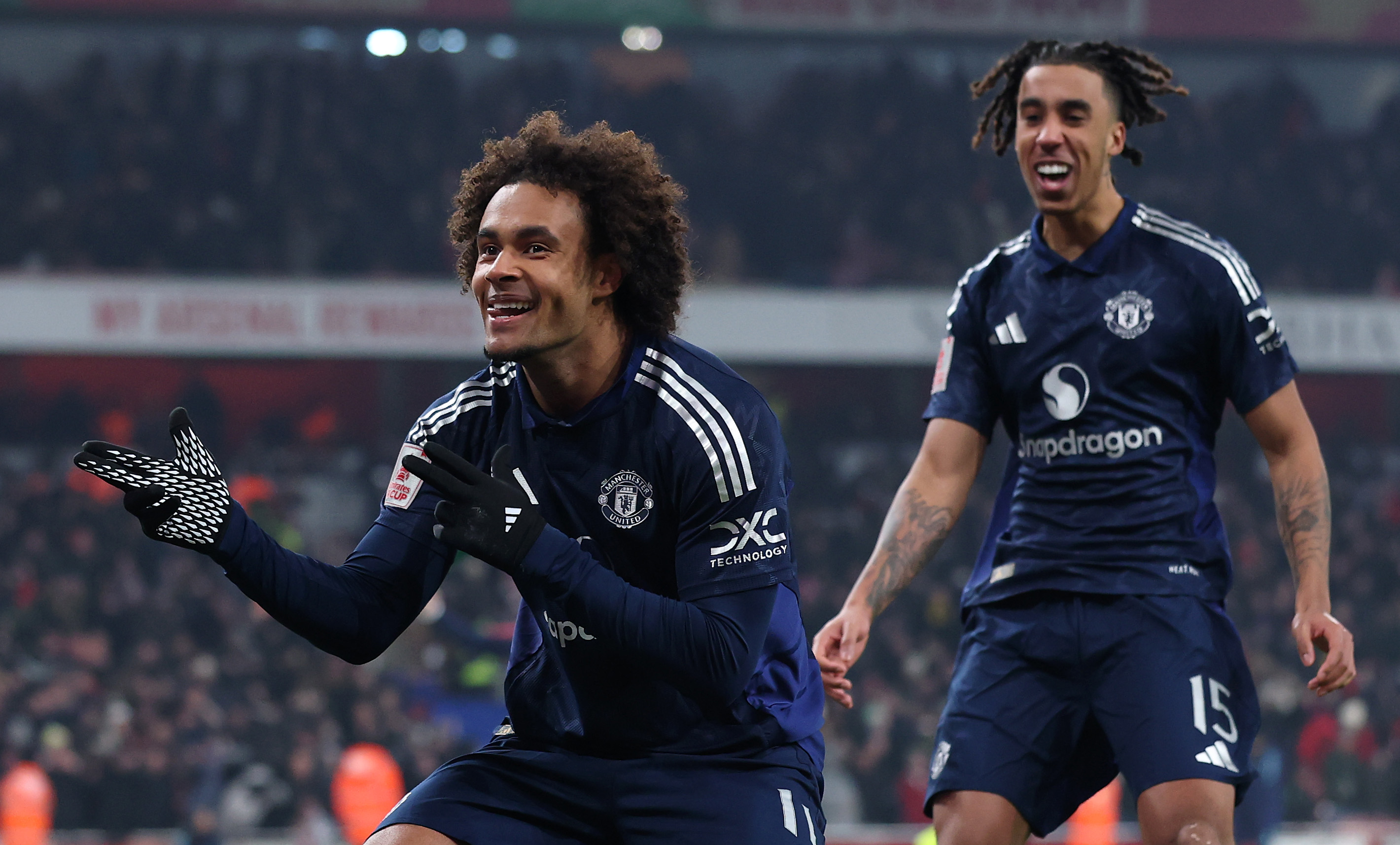 Joshua Zirkzee celebrates scoring the final spot-kick against Arsenal in the FA Cup
