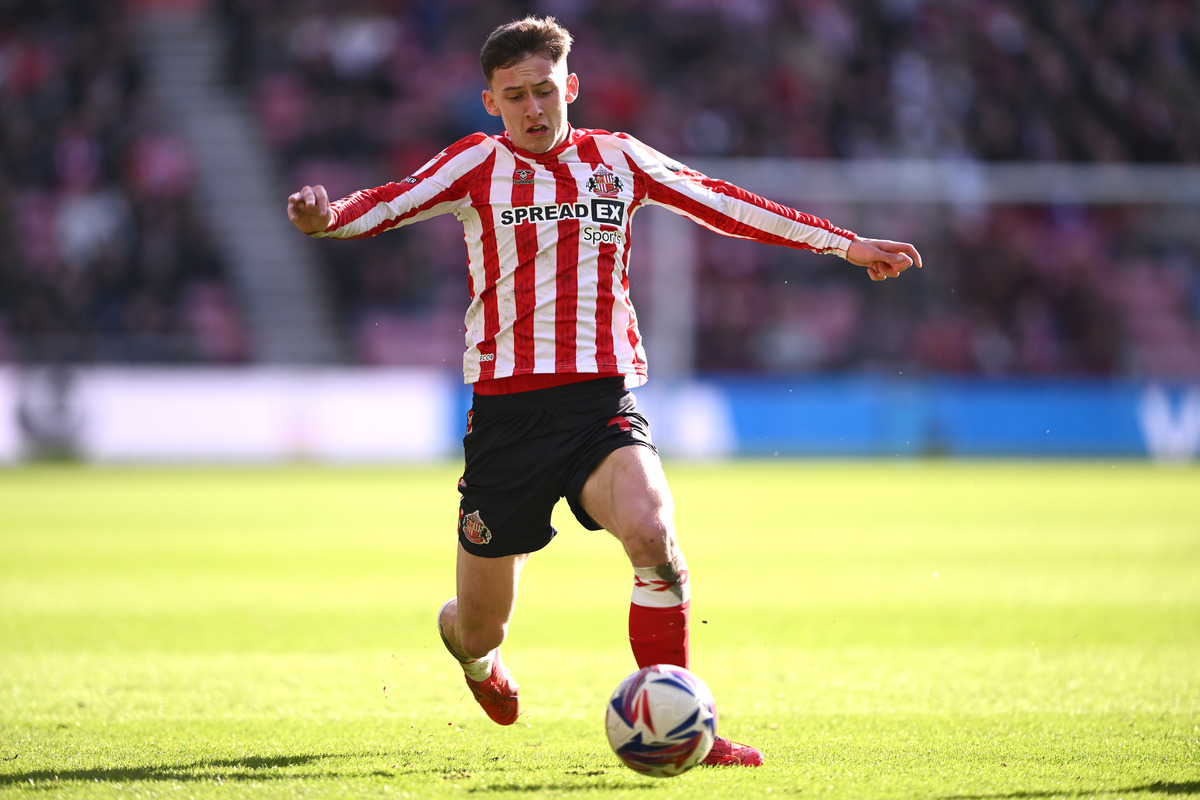 Chris Rigg dribbling with the ball