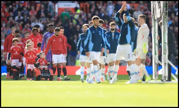Bruno Fernandes leads the Man United team out of the Stretford End tunnel.