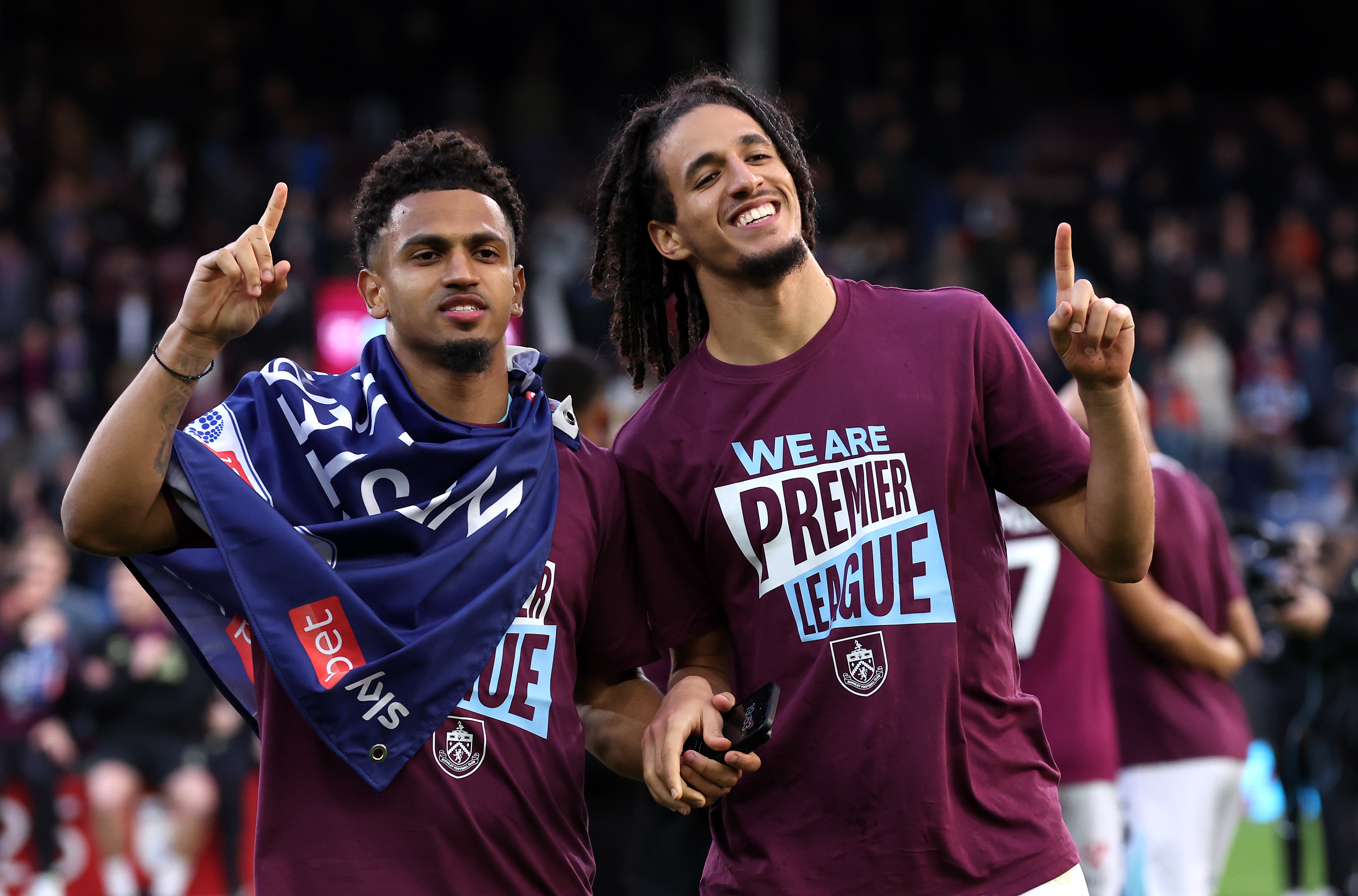 Hannibal Mejbri celebrates with teammate Marcus Edwards after Burnley’s promotion is confirmed.