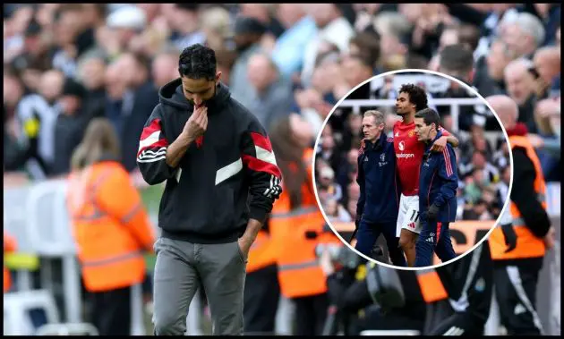 Ruben Amorim looks dejected clutching his chin next to injured Joshua Zirkzee.