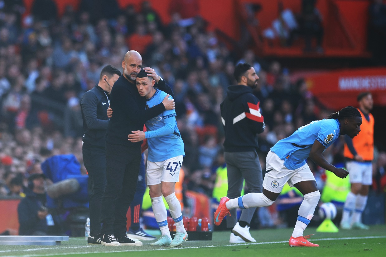 Pep Guardiola hugging Phil Foden