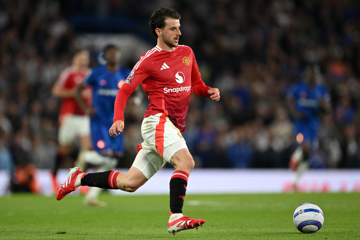 Mason Mount runs with the ball while in action at Stamford Bridge.