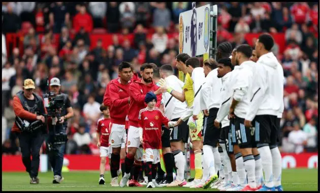 Bruno Fernandes leads Man United’s line of players as they exchange handshakes with the Aston Villa squad.