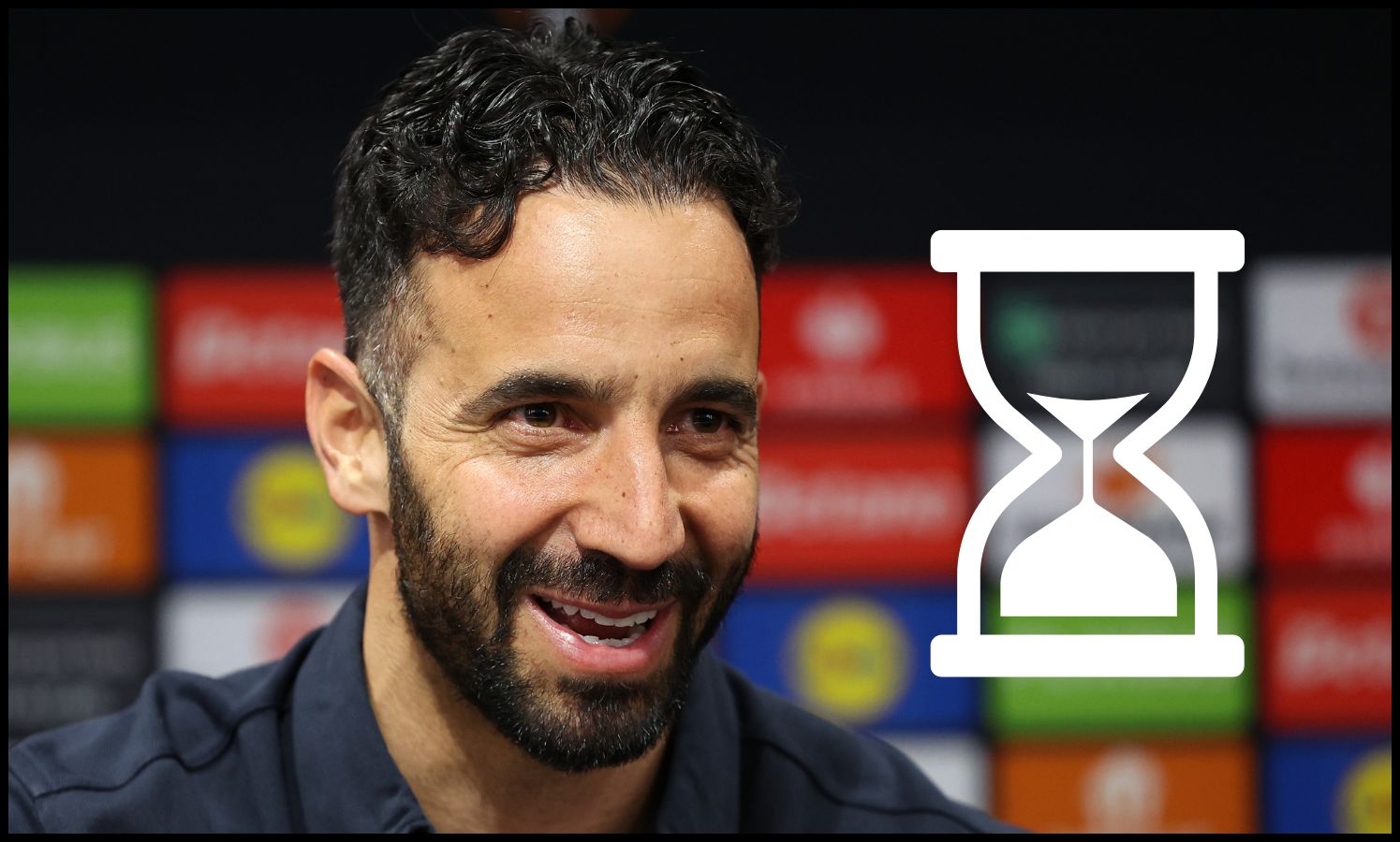 Ruben Amorim smiles during a Man United press conference,