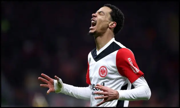 Hugo Ekitike screams in frustration with his hands raised.