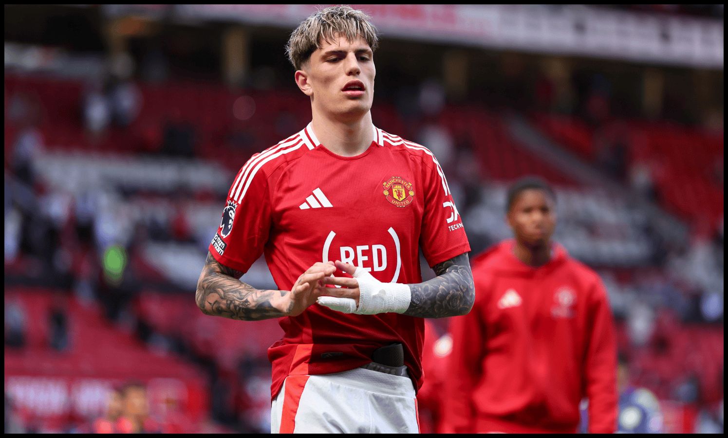 Alejandro Garnacho exits down the Stretford End at full-time vs West Ham.