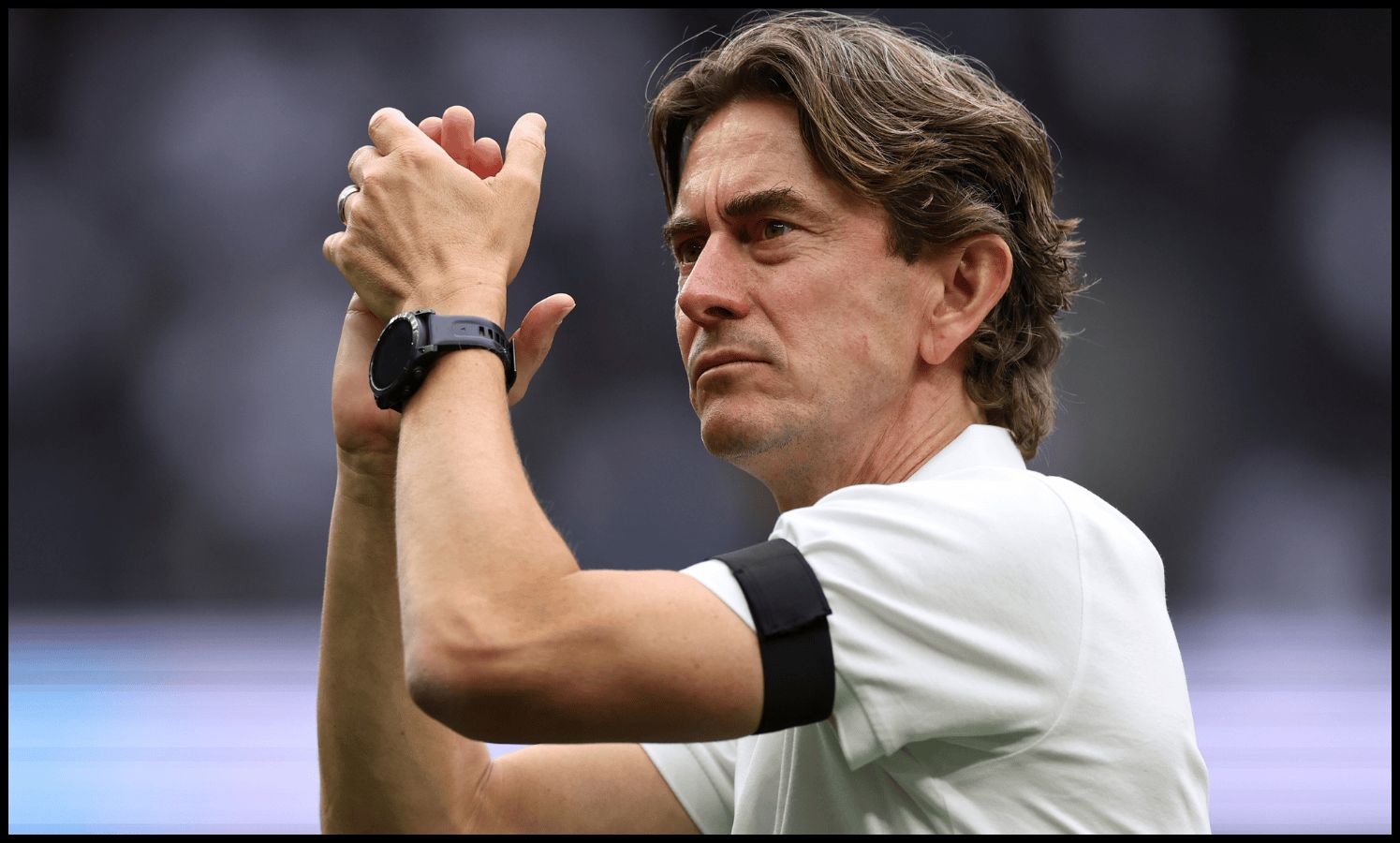 Thomas Frank applauds the Spurs fans after their win over Burnley.
