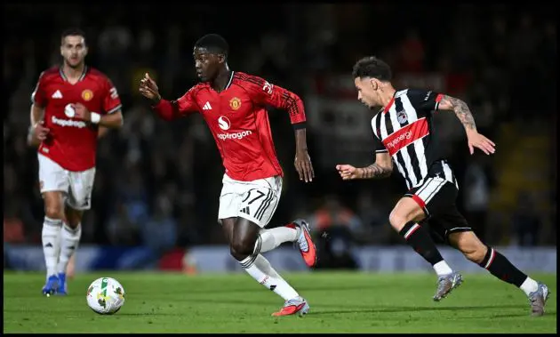 Kobbie Mainoo in action for Man United against Grimsby Town.