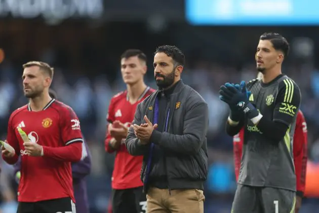 Ruben Amorim claps Manchester United fans alongside his players.