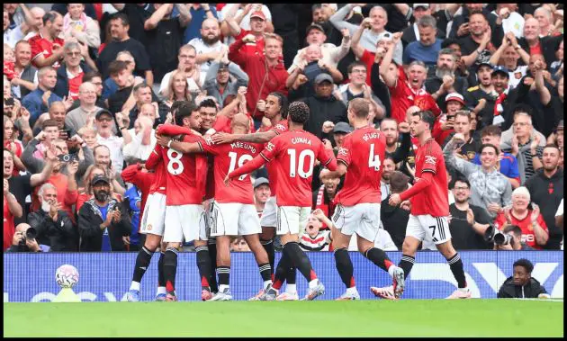Man United players celebrate Josh Cullen’s own-goal.
