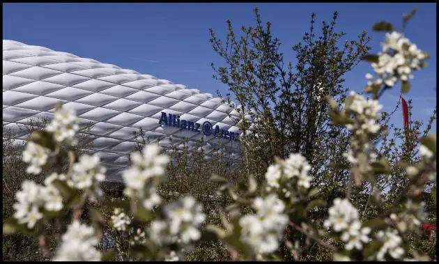 Flowers surround the Allianz Arena logo.
