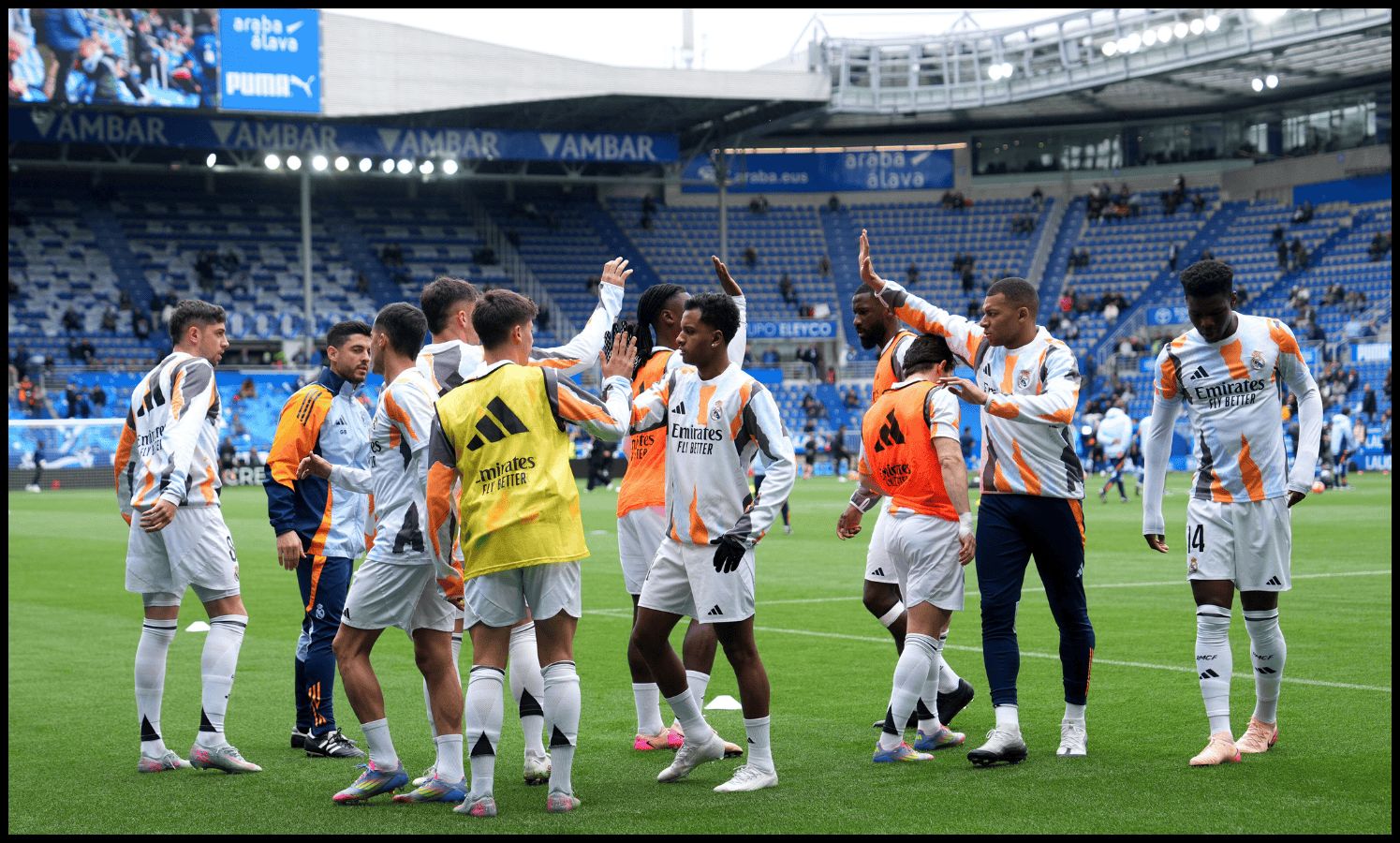Real Madrid players warm up before kick-off.