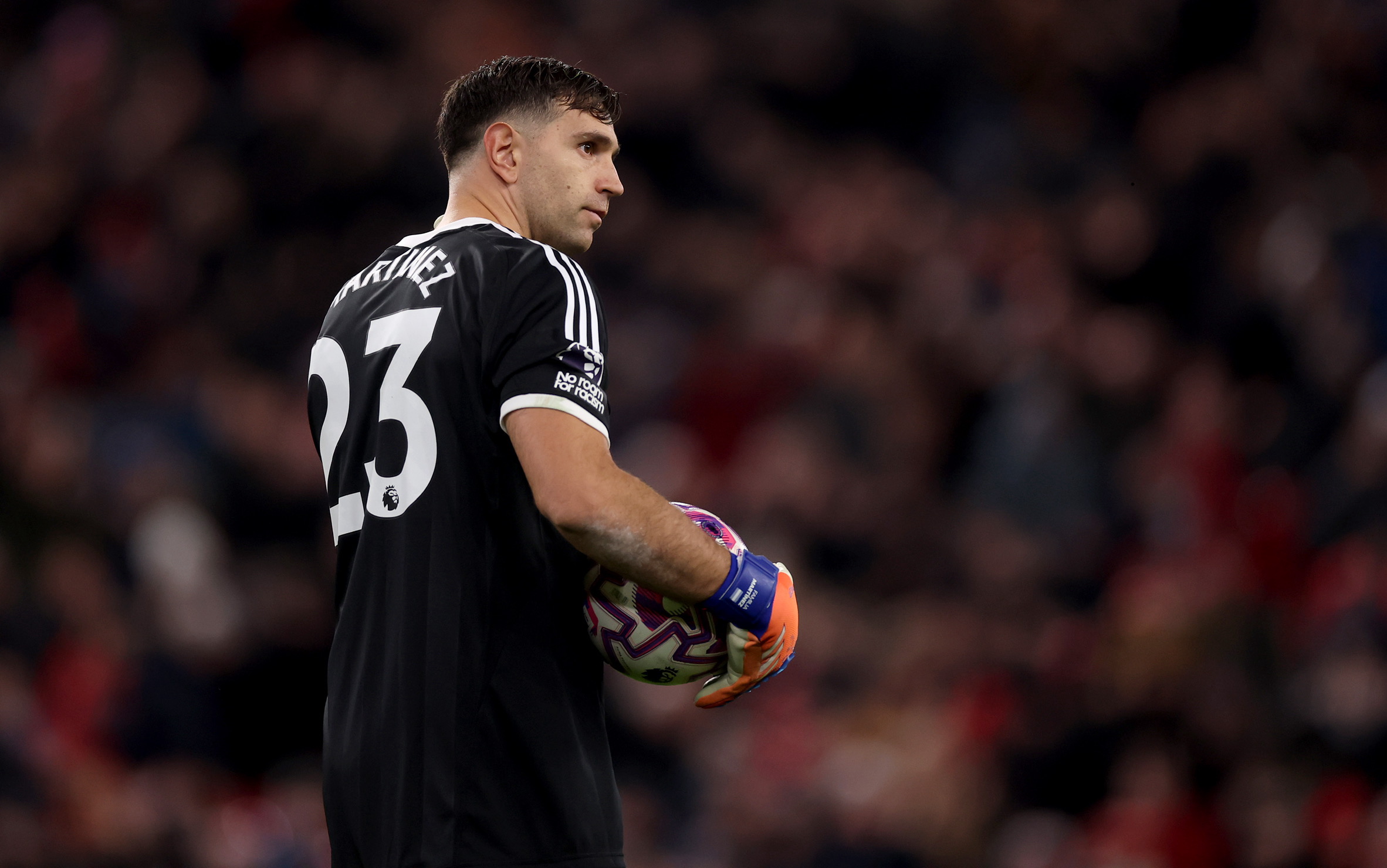Emi Martinez holds the ball at Anfield.