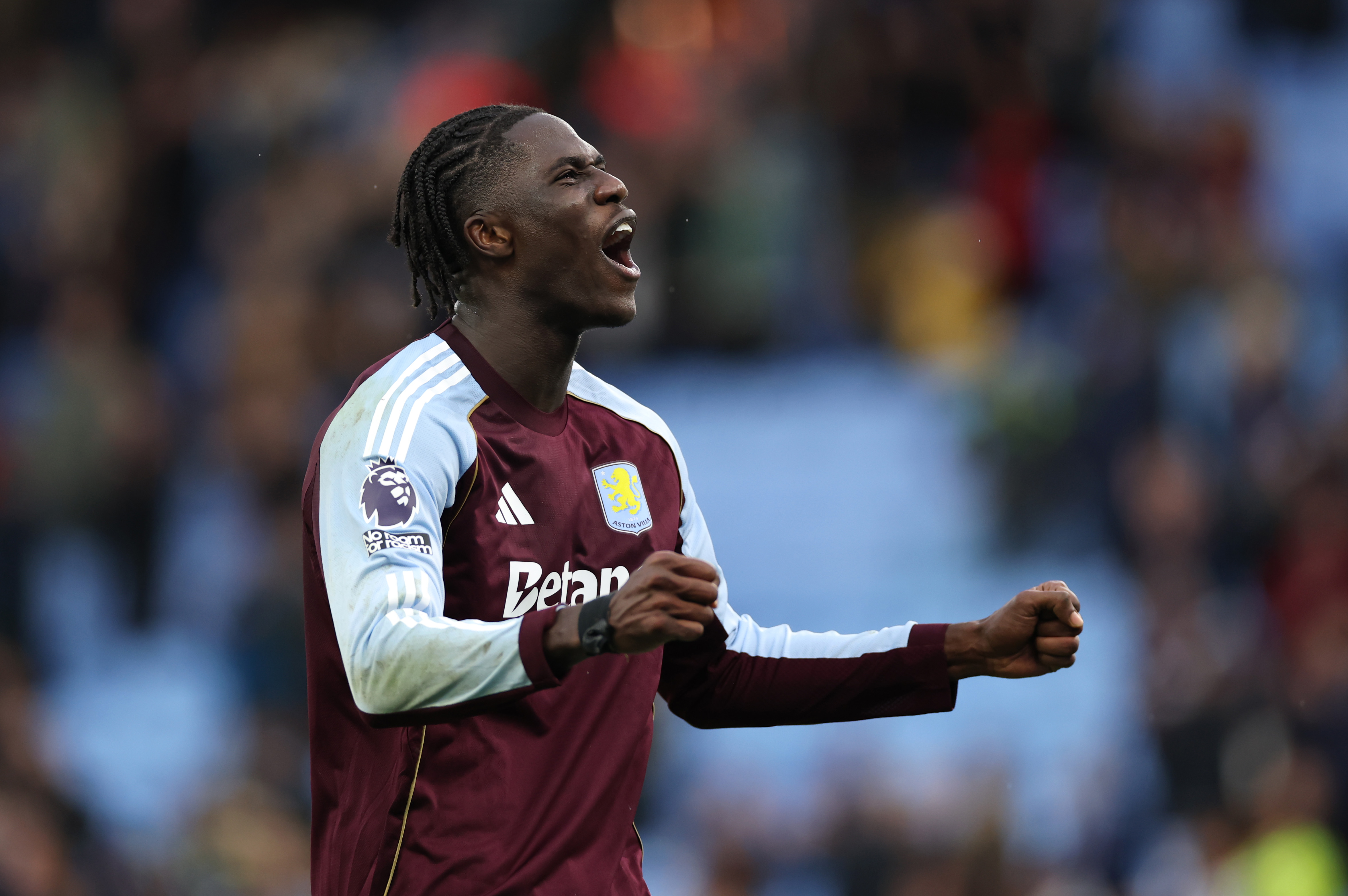 Amadou Onana celebrates with Aston Villa fans.