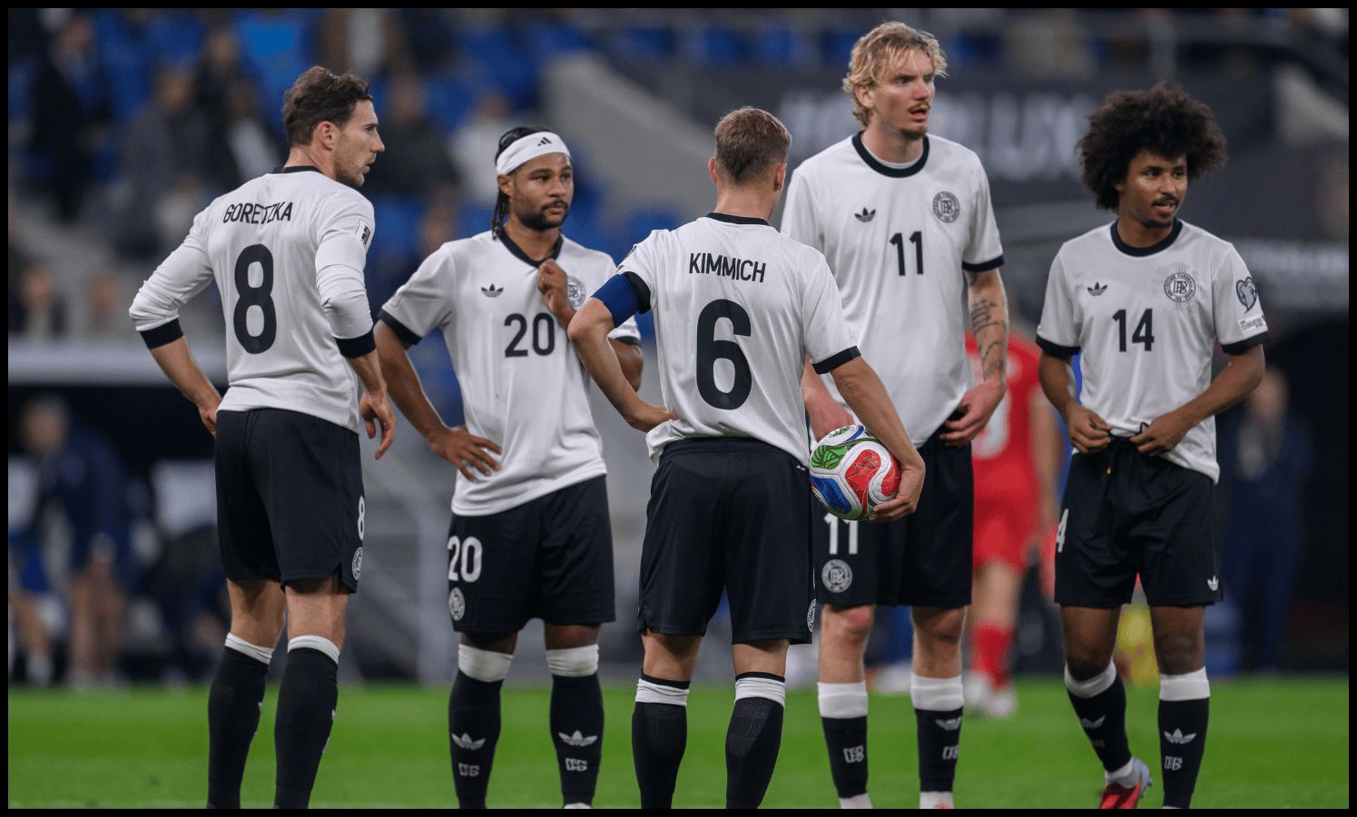 German players chat before taking a set-piece.