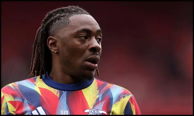 Eberechi Eze looks on while warming up for Arsenal.