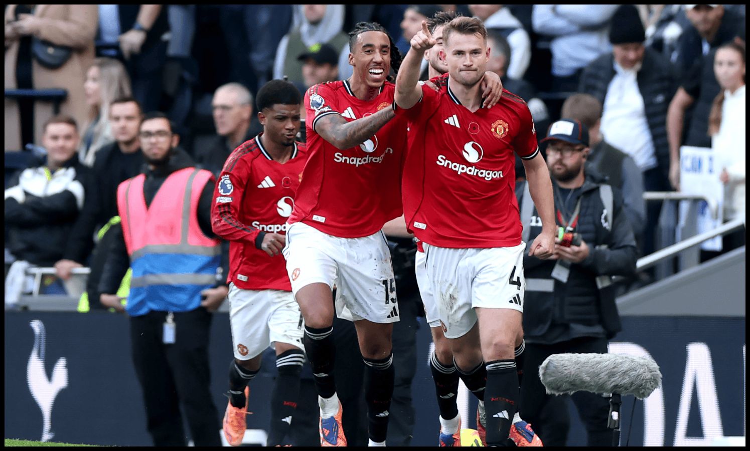 Amad Diallo and Leny Yoro celebrate with Matthijs de Ligt.