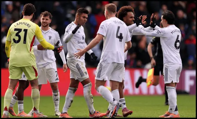 Man United players celebrate at full-time after beating Crystal Palace.