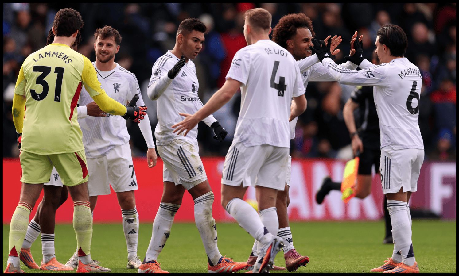 Man United players celebrate at full-time after beating Crystal Palace.