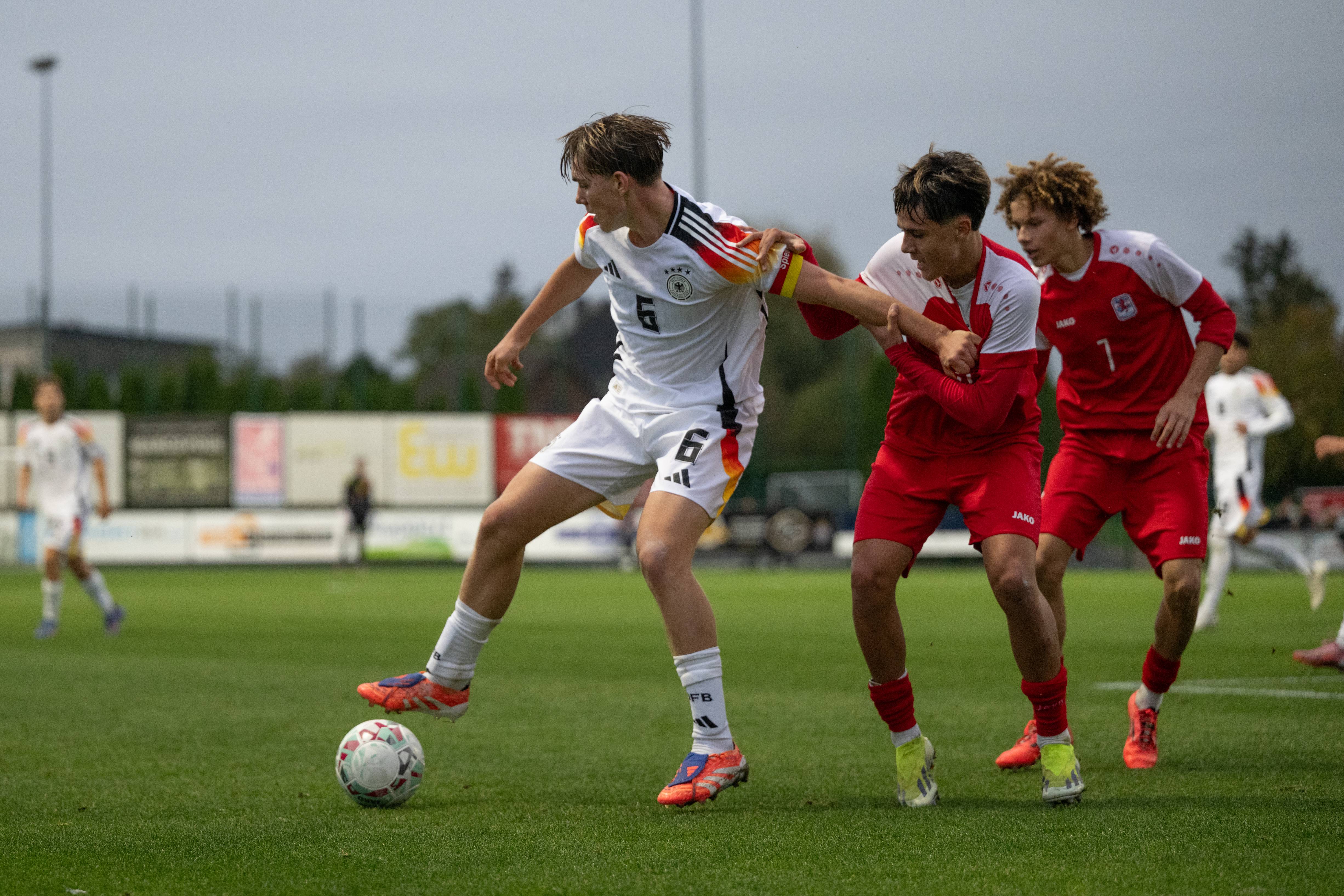 Kennet Eichhorn of Germany U17 challenges Jo Pimenta of Luxembourg U17