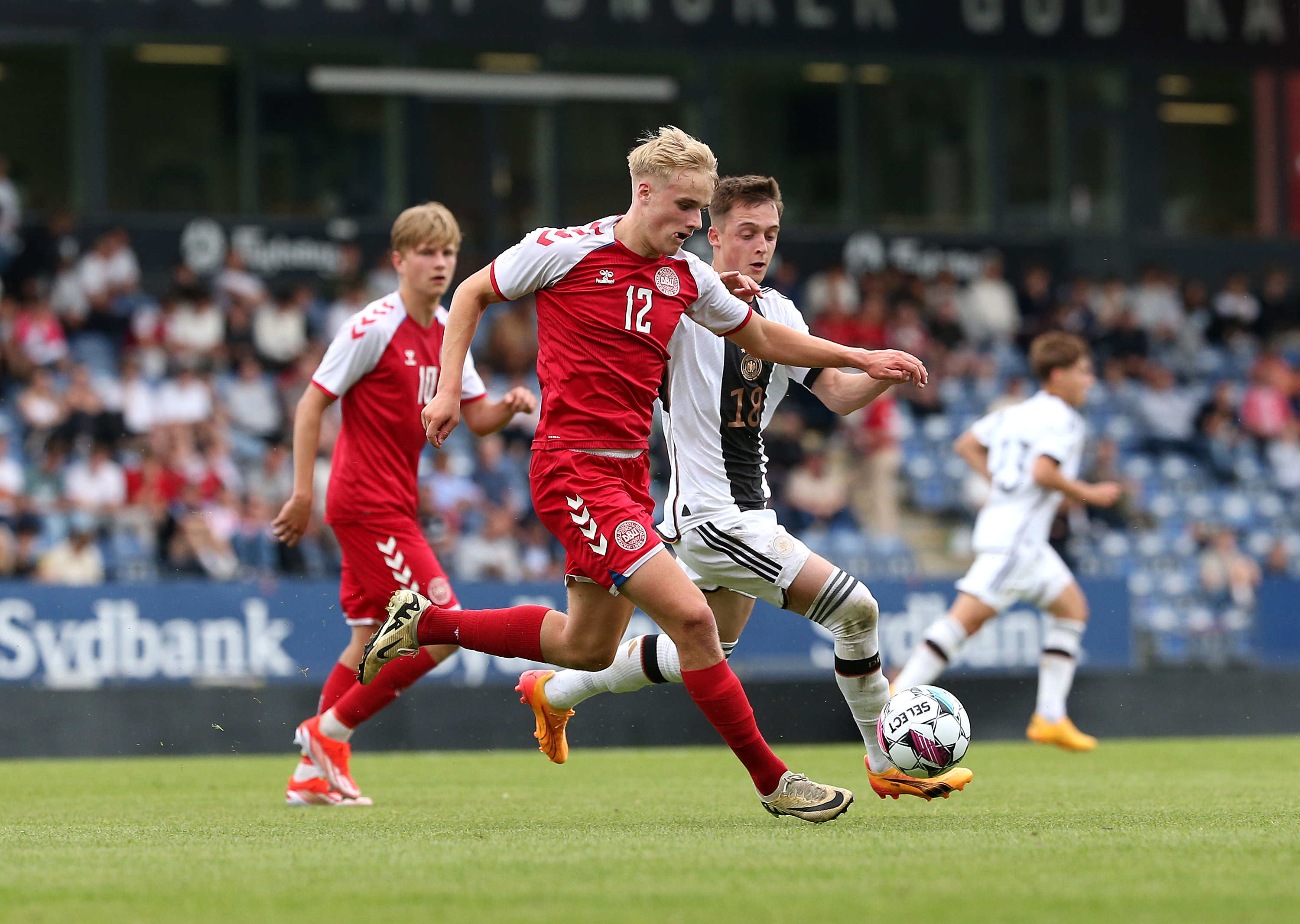Victor Froholdt of Denmark is challenged by Denis Pfaffenrot of Germany
