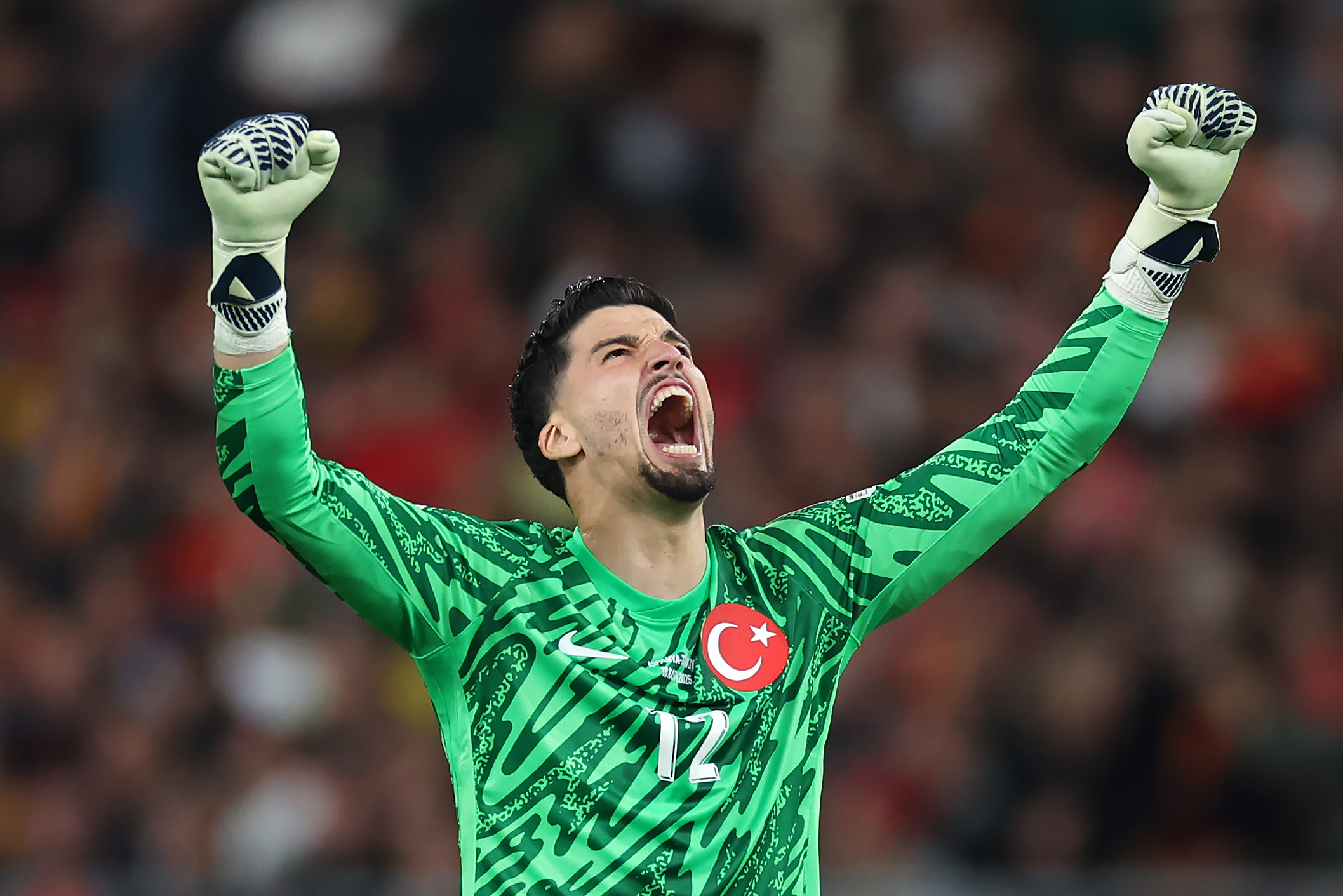 Altay Bayindir celebrates as Turkey score against spain.