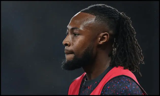 Antoine Semenyo looks on while warming up for Bournemouth.