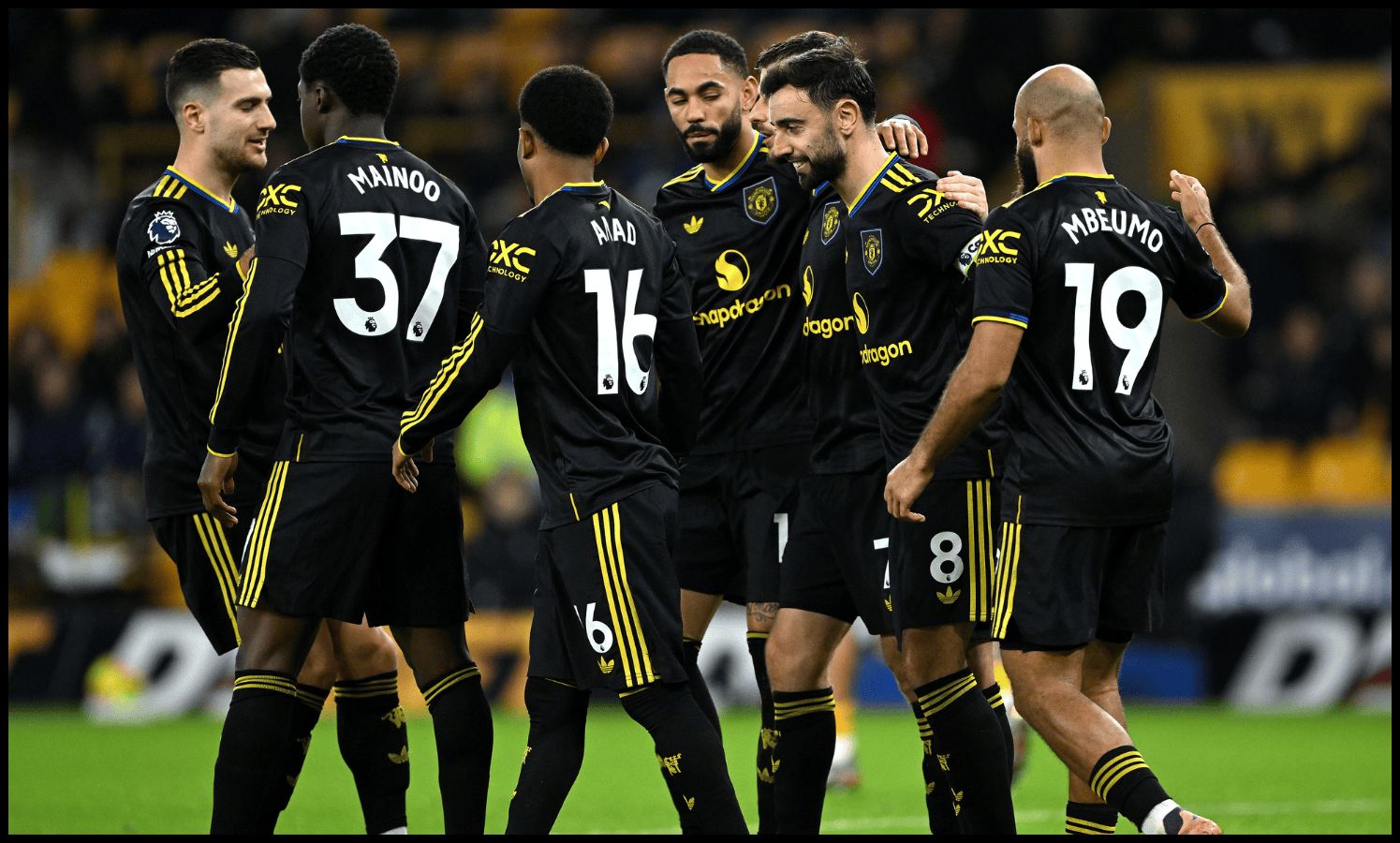 Man United players celebrate Bruno Fernandes’ goal vs Wolves.