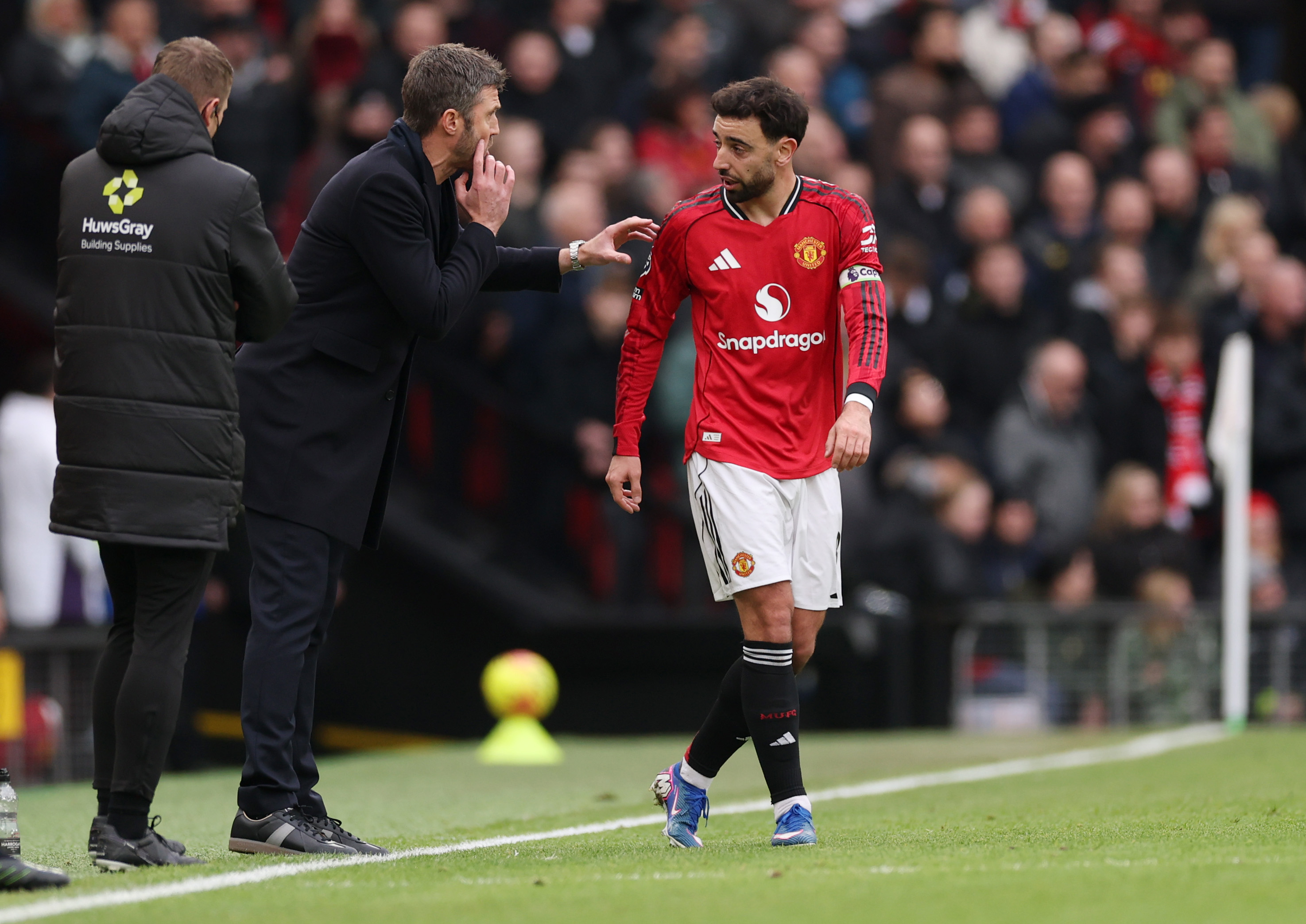 Bruno Fernandes gets instructions off of Michael Carrick.