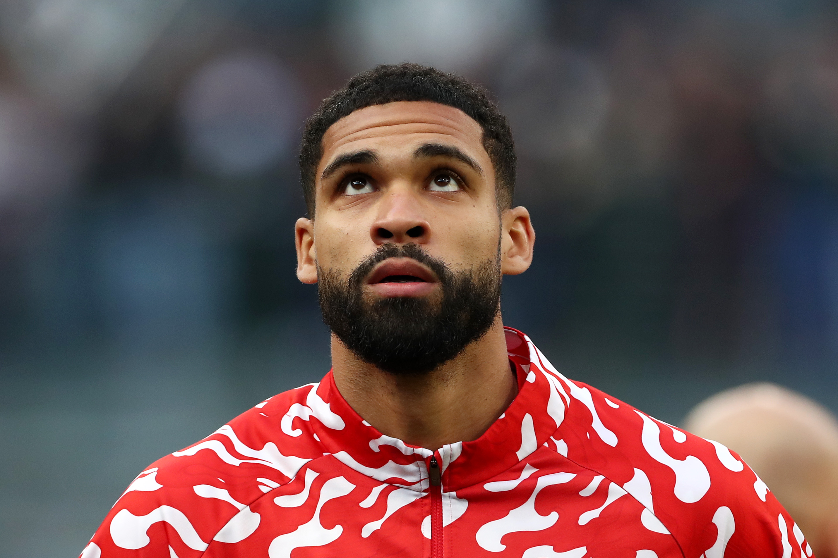 Ruben Loftus-Cheek looks on while warming up for AC Milan.