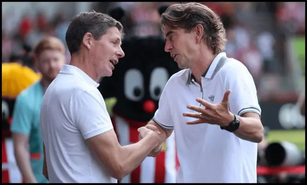 BRENTFORD, ENGLAND - AUGUST 18: Manager Thomas Frank of Brentford FC talks to Manager Oliver Glasner of Crystal Palace FC befor the Premier League match between Brentford FC and Crystal Palace FC at Gtech Community Stadium on August 18, 2024 in Brentford, England. (Photo by Eddie Keogh/Getty Images)