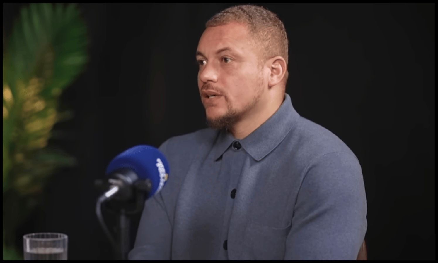 Wes Brown talks on a podcast.