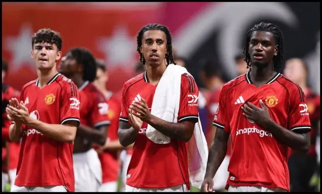 Tyler Fredricson, Leny Yoro and Ayden Heaven applaud the Man United fans.
