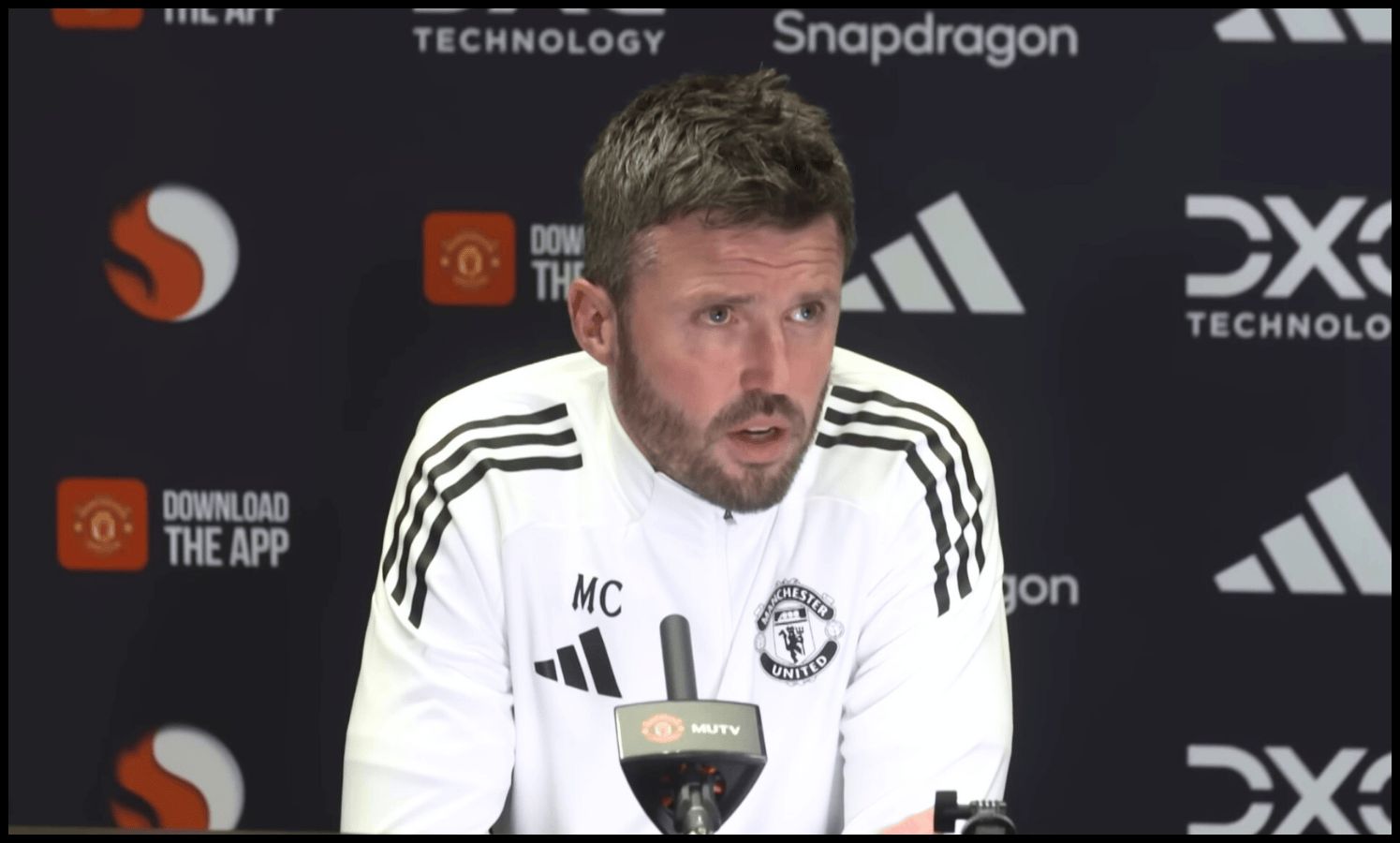Michael Carrick talks at a press conference.