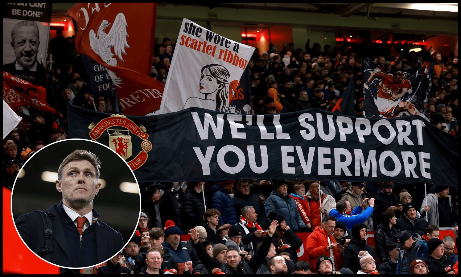 Man United fans hold up flags at the Stretford End.