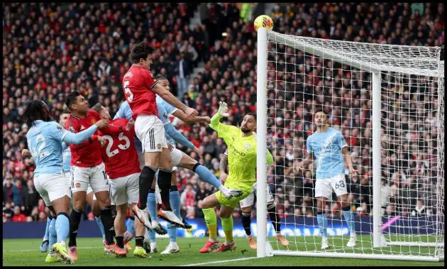 Harry Maguire heading the ball against Man City