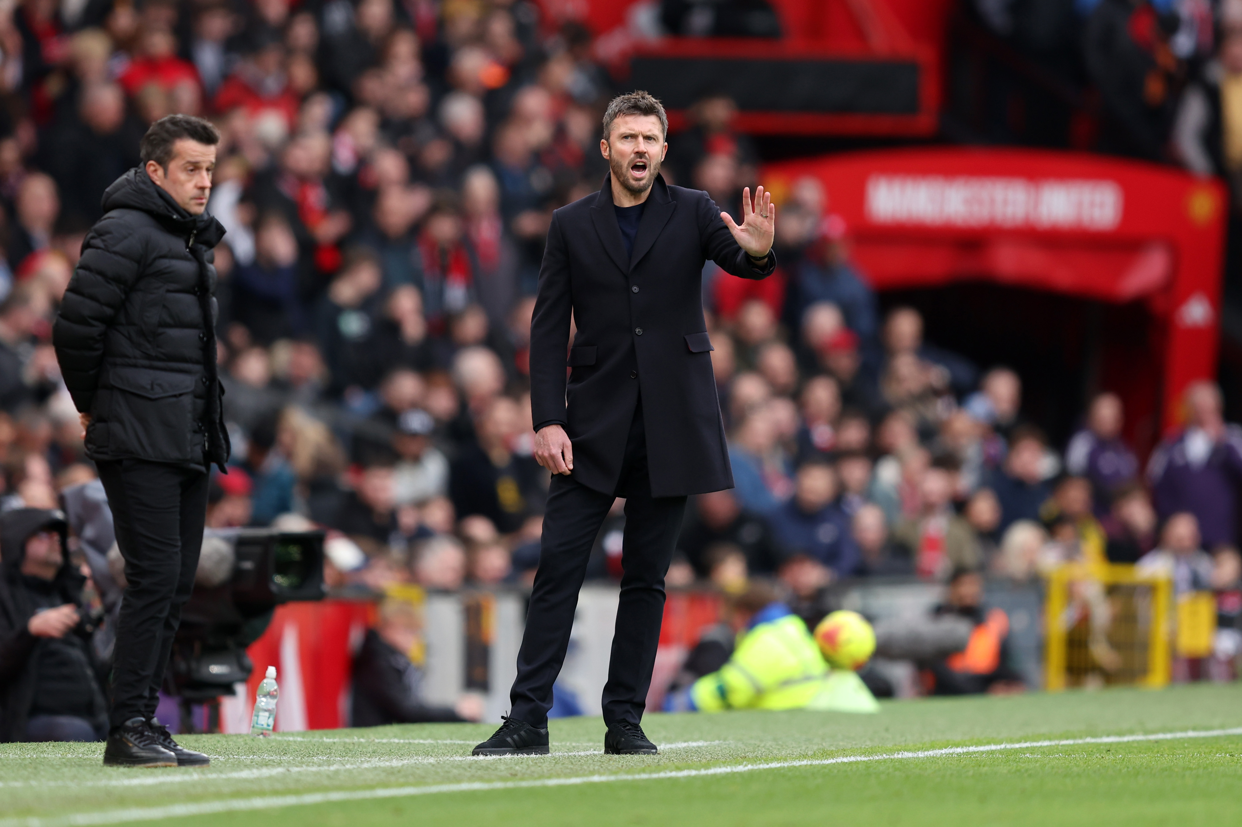 Michael Carrick gestures from the touchline at Old Trafford.