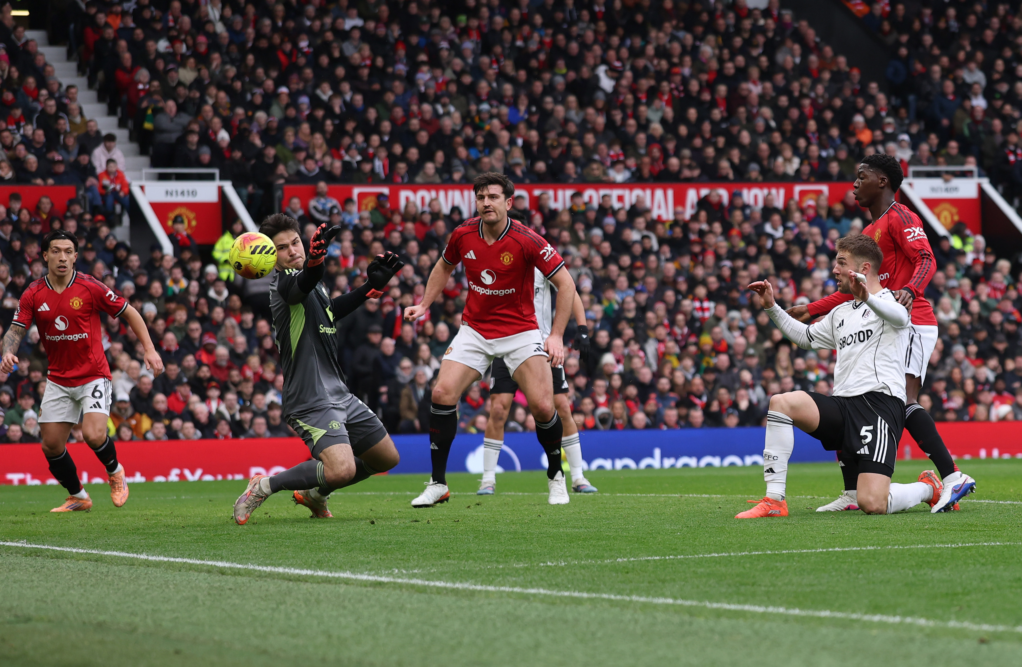 Senne Lammens stops a certain goal from Fulham’s Joachim Anderson.