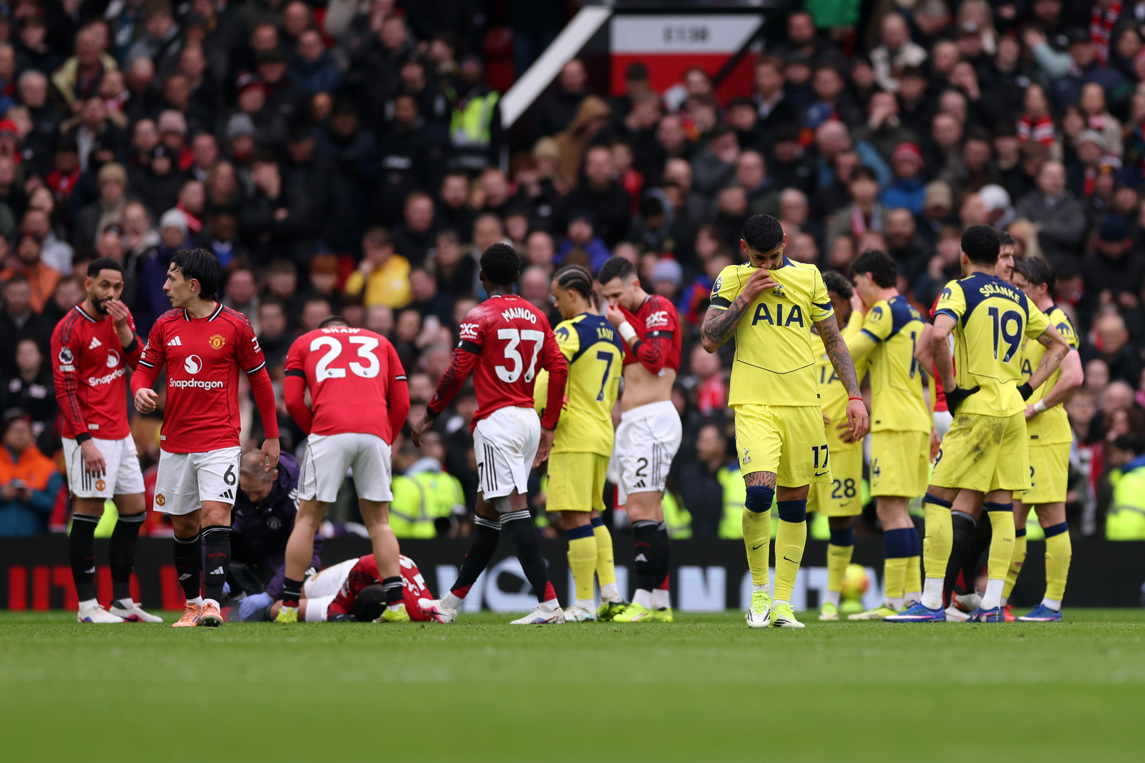 Tottenham captain Cristian Romero walks off the pitch at Old Trafford after being shown a red card vs Man United. 