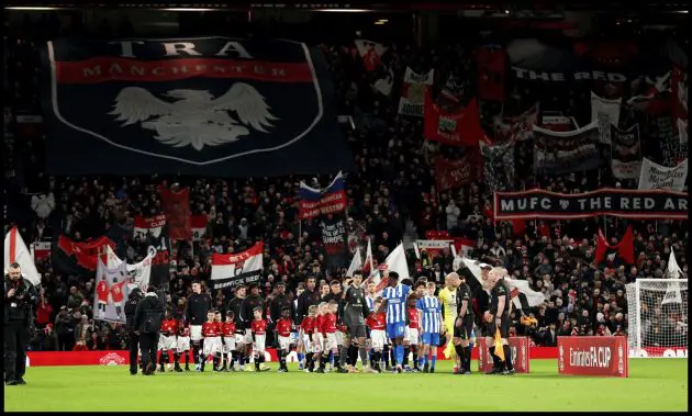 Man United and Brighton players walk out at Old Trafford.