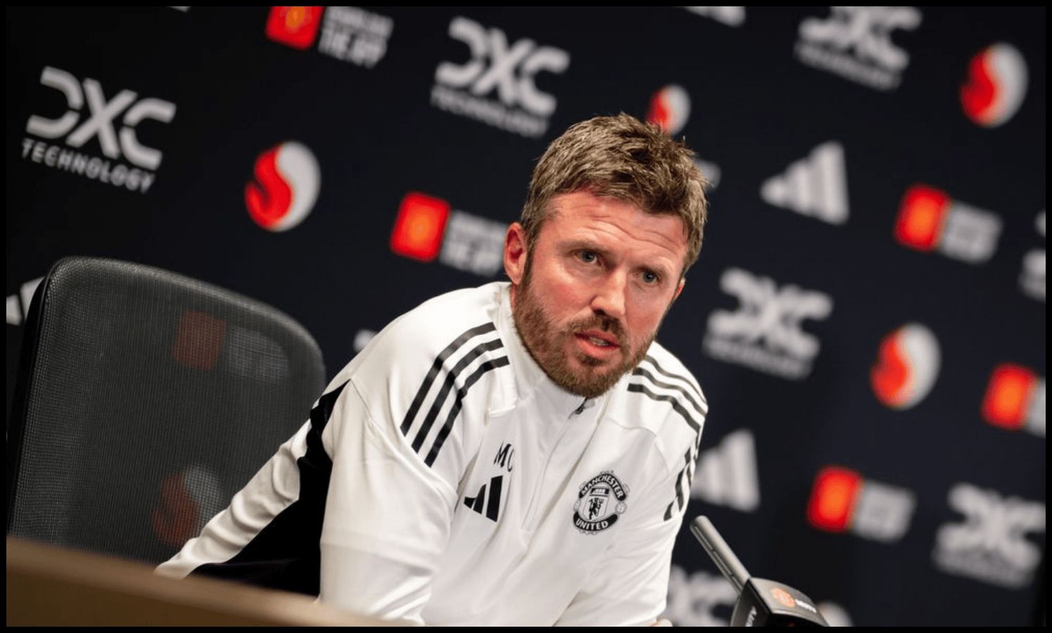 Michael Carrick talks to reporters at a press conference at Carrington.